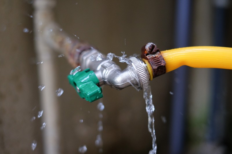 Water,Drop,Leaking,From,Faucet